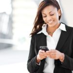 Woman receiving text message on cell phone